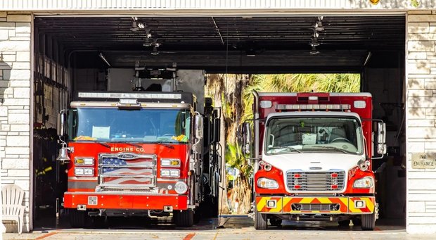 A fire truck and an ambulance in a gargae