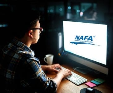 A person looking at the NAFA logo on a computer