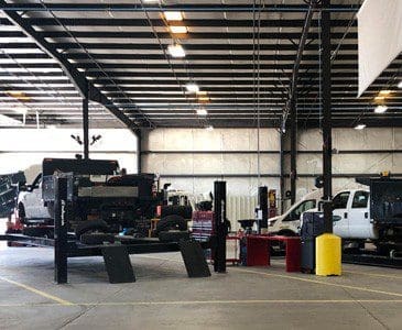 Image of trucks in a maintenance facility