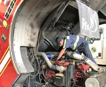 A Vector tech working on a fire truck