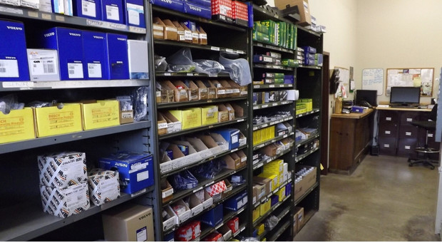 Organized shelf of fleet vehicle parts demonstrating efficient parts inventory management