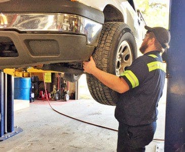 Vector technician replacing a trucks tire