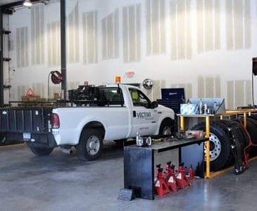 Vector work truck in a garage