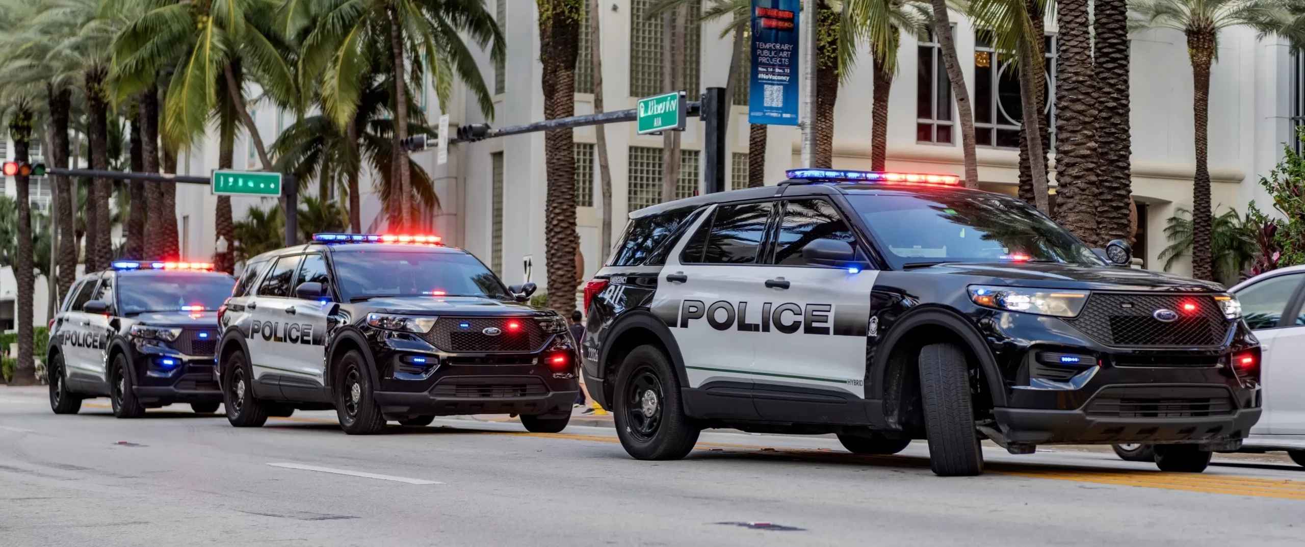 Three police cars with their lights on