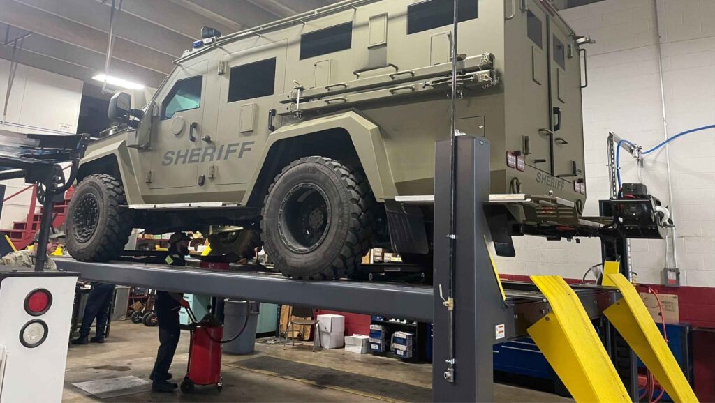 Technician Under Sheriff Vehicle